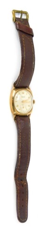 An Audax 9ct gold cased gent's wristwatch, with a silver numeric watch head, on black leather strap.