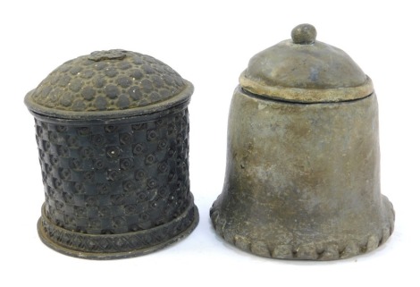 Two 19thC lead tobacco jars, both of cylindrical form, one decorated with a cheque board pattern, 12cm high, the other of cylindrical flared plain form, 15cm high.