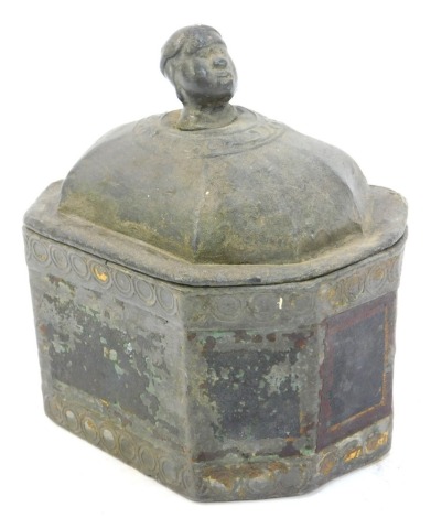 A 19thC lead tobacco jar, of sarcophagus form, the handle cast in the form of a male head, 13cm high.