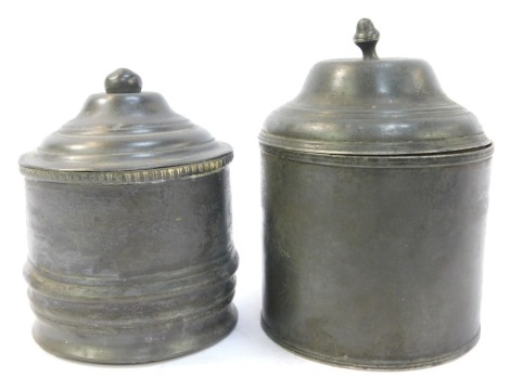 Two 19thC pewter tobacco jars, each of cylindrical form, one with banded decoration, one with banded decoration, the largest 16cm high.