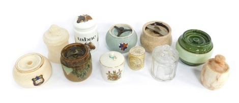 A group of tobacco and marmalade jars, to include St Martins Varsity Bitter Marmalade jar and cover, decorated with an applied crest, 10cm high, a Goss ware George III commemorative jar and cover, 13cm high, etc. (1 tray)