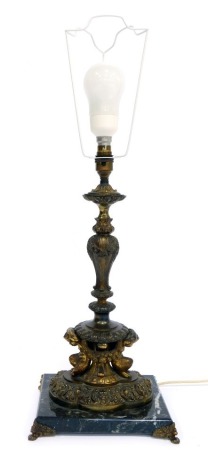 A cast metal table lamp, decorated with cast floral swags, mythical figures, etc, on a marble base, 51cm high.WARNING! This lot contains untested or unsafe electrical items.  It is supplied for scrap or re-conditioning only. TRADE ONLY 