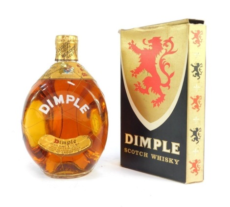 A bottle of Dimple Scotch Whisky, boxed.