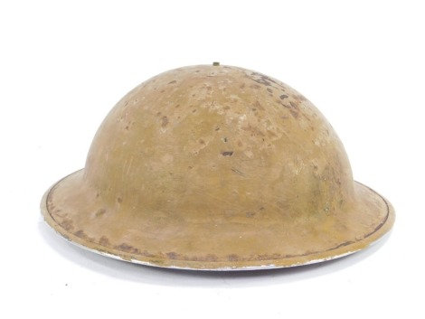 A WW1 British Brodie tin helmet.