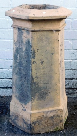 A terracotta chimney pot, of hexagonal form, stamped H Lunby, J H Martins Terracotta Works 1869, 79cm high.