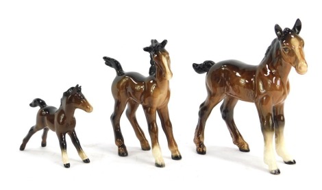 Three Beswick pottery horses, the largest 15cm high.