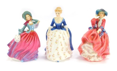 Three Royal Doulton porcelain figures, modelled as Alison, HN2336, Pretty Ladies Autumn Breeze, HN4716, and Top of the Hill, HN1849.