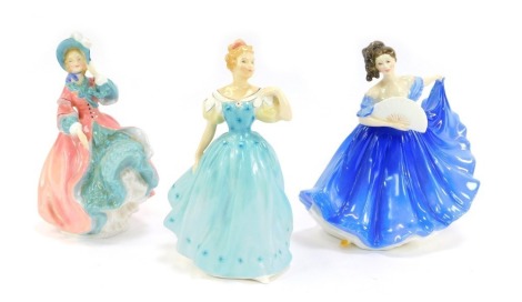 Three Royal Doulton porcelain figures, modelled as Elaine, HN2791, Spring Morning, HN1927, and Enchantment, HN2178.