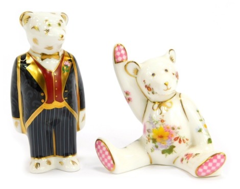 Two Royal Crown Derby porcelain paperweights, modelled as Mini Bear Groom, and a seated teddy bear with one arm raised, the latter in an associated box. 