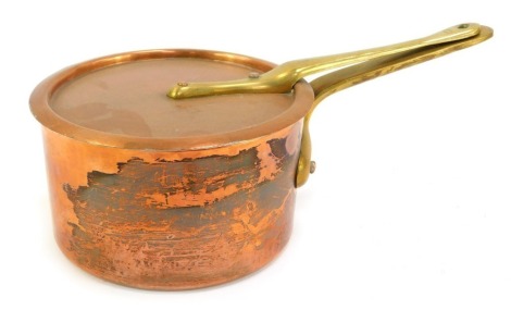 A Divertimenti of London copper saucepan and lid, with brass handle, 17cm diameter.