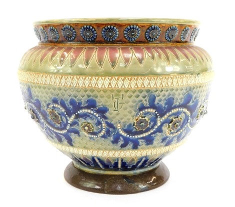 A Doulton Lambeth stoneware jardiniere, with etched and relief moulded decoration, flowers, beaded scrolls, other foliate motifs, etc., stamped, 20cm high. (AF)