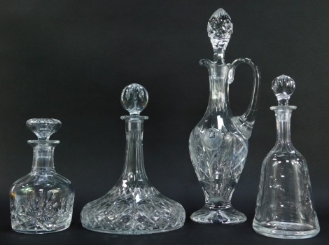 A group of decanters, to include ship's decanter, 30cm high, claret jug and stopper, 46cm high, etc.