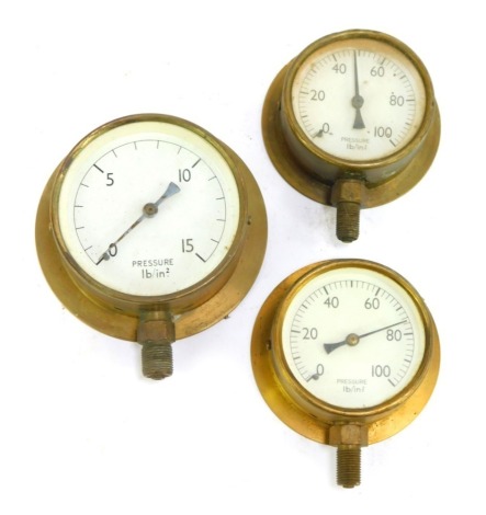 Three brass cased pressure gauges, the largest dial 10cm diameter.