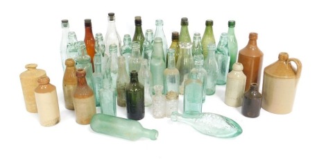 A collection of late 19thC and later glass bottles and stoneware bottles, including Lee and Green Limited of Bourne, Higgins and Sons Limited Castle Brewery of Bedford, Morgans of Norwich, and Whysall of Grantham. (a quantity)