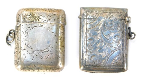 A George V silver Vesta case, with foliate engraving, shield reserve, monogram engraved, Birmingham 1920, together with a further Vesta case, with engraved decoration, circular vacant reserve, Chester 1929, 1.82oz. (2)