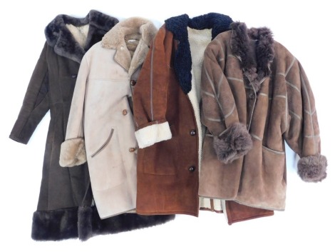 Four suede lady's coats, one in brown with embroidered decoration and fur collar and sleeve cuffs, various sizes.