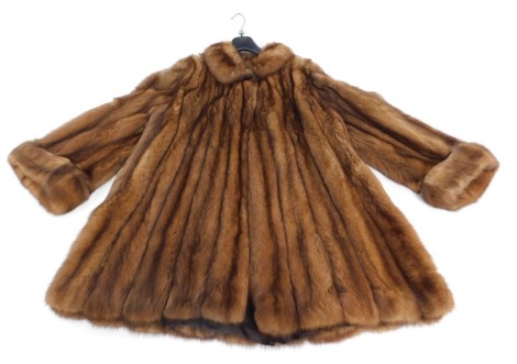 A mink three quarter length coat, underarm measurement 40cm.