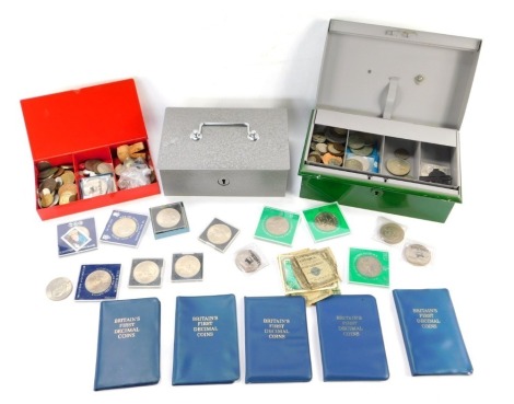 Georgian and later silver and copper coinage, Britain's First Decimal coin sets, world coinage, commemorative crowns and bank notes, in three cash tins. (a quantity)