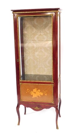 A 20thC Continental display cabinet, the top with a moulded edge above a glazed door flanked by two glazed sides, with lower floral decorated panels, raised on ormolu cabriole legs, 160cm high, 62cm wide, 39cm deep.