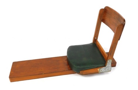 An oak boat seat, with PVC green seat.