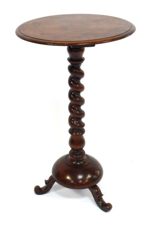 A Victorian mahogany occasional table, with a circular top, raised on a spiral fluted column over a circular base and three scroll feet, 74.5cm high, 43cm wide.