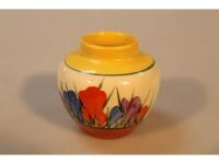 A small pottery vase painted in the Clarice Cliff crocus pattern