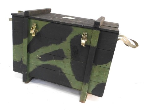 A black and green camouflage painted ammunition box, 65cm high, 87cm wide, 52cm deep.