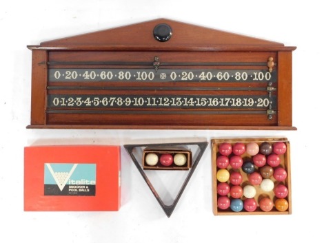 A Victorian mahogany wall mounted snooker scoreboard, 46cm high, 106cm wide, together with vintage snooker balls, Vitalite snooker and pool balls, boxed, and a snooker triangle.