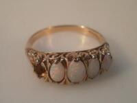 A 9ct gold five stone dress ring set with opals