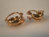 A pair of yellow metal clip earrings stamped .375