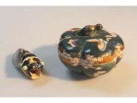 A pottery figure of a cicada and a quatrefoil pottery trinket box decorated with butterflies