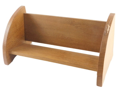A Robert Mouseman Thompson oak book stand, with two rounded ends, one carved with a mouse, 45cm wide.