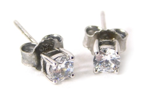 A pair of silver and CZ set cluster earrings.