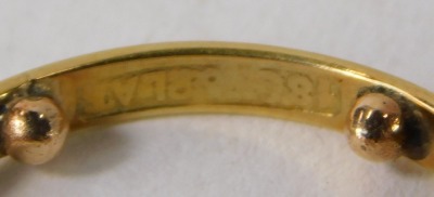 An 18ct gold and platinum twist ring, the floral cluster set with tiny diamonds, with white metal twist shoulders on a yellow metal band, with ring size markers, ring size M½, 3.3g all in. - 2