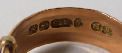 A 9ct gold wedding band, of hammered and etched buckle design, ring size L½, 3.4g all in. - 2