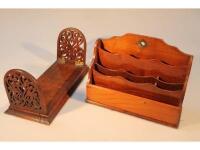 An early 20thC letter rack and mahogany sliding book stand.