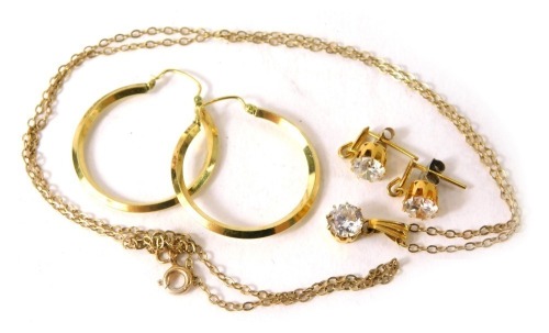 A group of costume jewellery, comprising a pair of 14ct gold front hoop earrings, paste stone set pendant and chain in 9ct gold mount, with matching earrings, 3.4g all in.