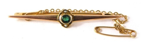 A bar brooch, set with central blue topaz and two seed pearls on a yellow metal base stamped 9ct, 4.5cm diameter, with safety chain, 2.2g all in.