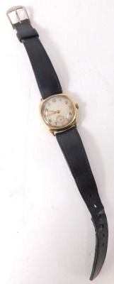 A Raymond Weil 9ct gold cased wristwatch, with a silvered numeric dial and gold hands, with seconds dial, 17 dual movement on a later black leather strap, the dial 2.5cm diameter, 28.1g all in. - 2