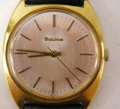 Two wristwatches, comprising a Bulova Spinnaker green wristwatch, serial number 3-349538, and numbered 2, on a later black leather strap, the dial 3cm diameter, and a Bulova gent's gold finish wristwatch, 3cm diameter. (2) - 4