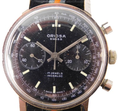 An Oriosa Swiss chronograph wristwatch, with a seventeen jewel Incabloc movement, on a black dial with cream markers, in stainless steel case, on a later material striped strap, 3cm diameter.