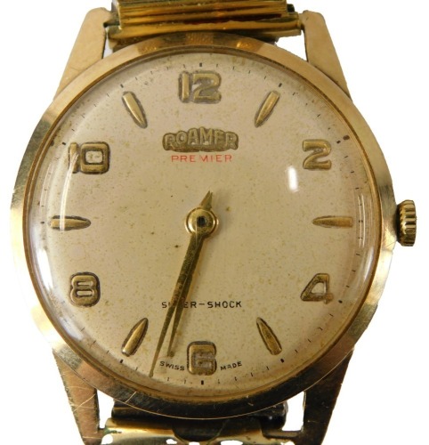 A Roamer 9ct gold cased gent's wristwatch, with a silvered finish numeric dial, on an expanding gold plated strap, 3cm diameter, 53.7g all in, boxed.