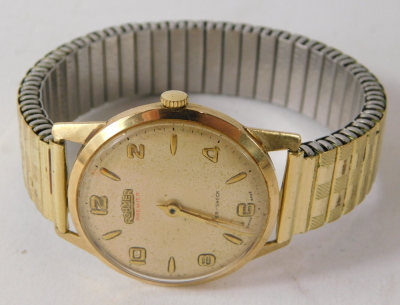 A Roamer 9ct gold cased gent's wristwatch, with a silvered finish numeric dial, on an expanding gold plated strap, 3cm diameter, 53.7g all in, boxed. - 2
