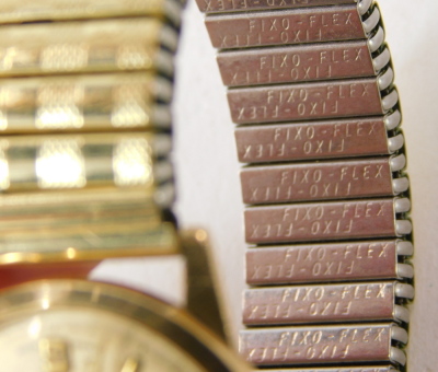 A Roamer 9ct gold cased gent's wristwatch, with a silvered finish numeric dial, on an expanding gold plated strap, 3cm diameter, 53.7g all in, boxed. - 3