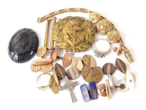 A carved jet brooch, depicting figure, a partial naval officer's buckle, and various military buttons. (a quantity)