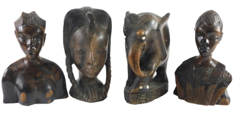 An African hardwood tribal carved bust, two similar busts and a carved elephant, embellished with bone. (4)