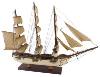 A scale model of a four masted sailing ship, with cream painted hull and rectangular base, 69cm wide.