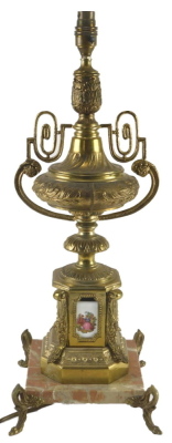 A Continental gilt metal and marble table lamp, of urn form with porcelain mounts, printed with figures, 60cm high.