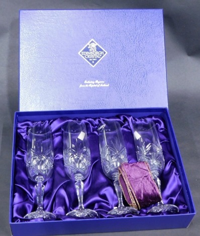 A cased set of four Edinburgh crystal champagne flutes, boxed.