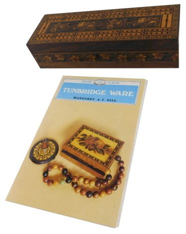 A late 19thC rosewood and Tunbridge ware cribbage box, the lid decorated with flowers within geometric borders, hinged to enclose a fitted interior with scorers, etc., 25cm wide, and a Shire book on Tunbridge ware by Gill (Margaret AV).